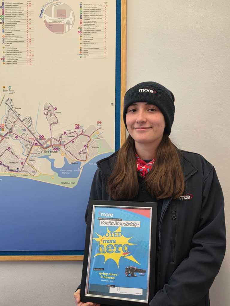 Bonita holding up her certificate