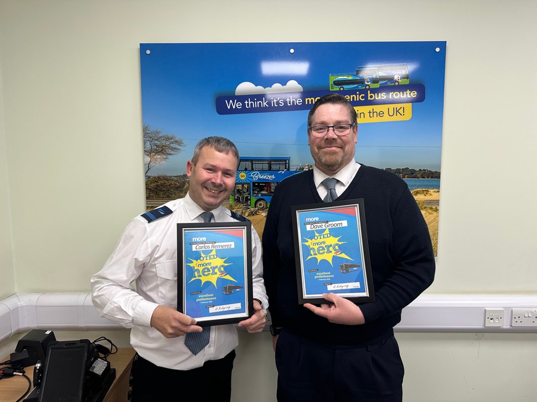 Carlos and Dave holding up their certificates