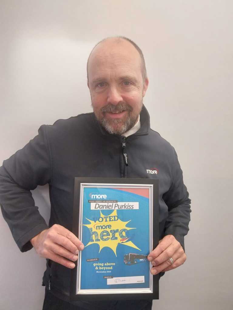 Dan holding up his certificate