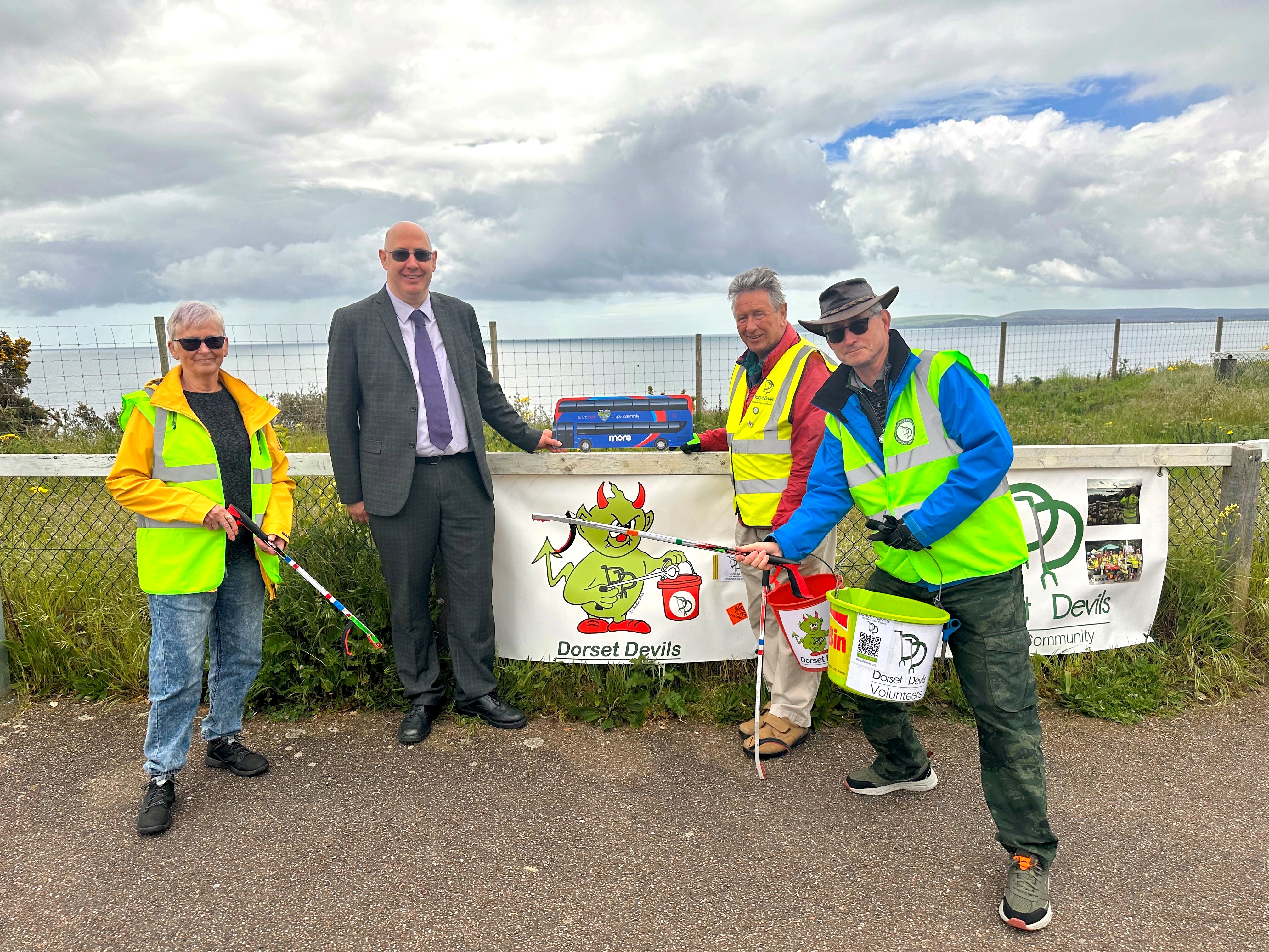 Dorset Devils litter pickers with Richard Wade - morebus general manager image
