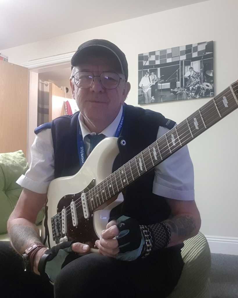 Man holding a guitar