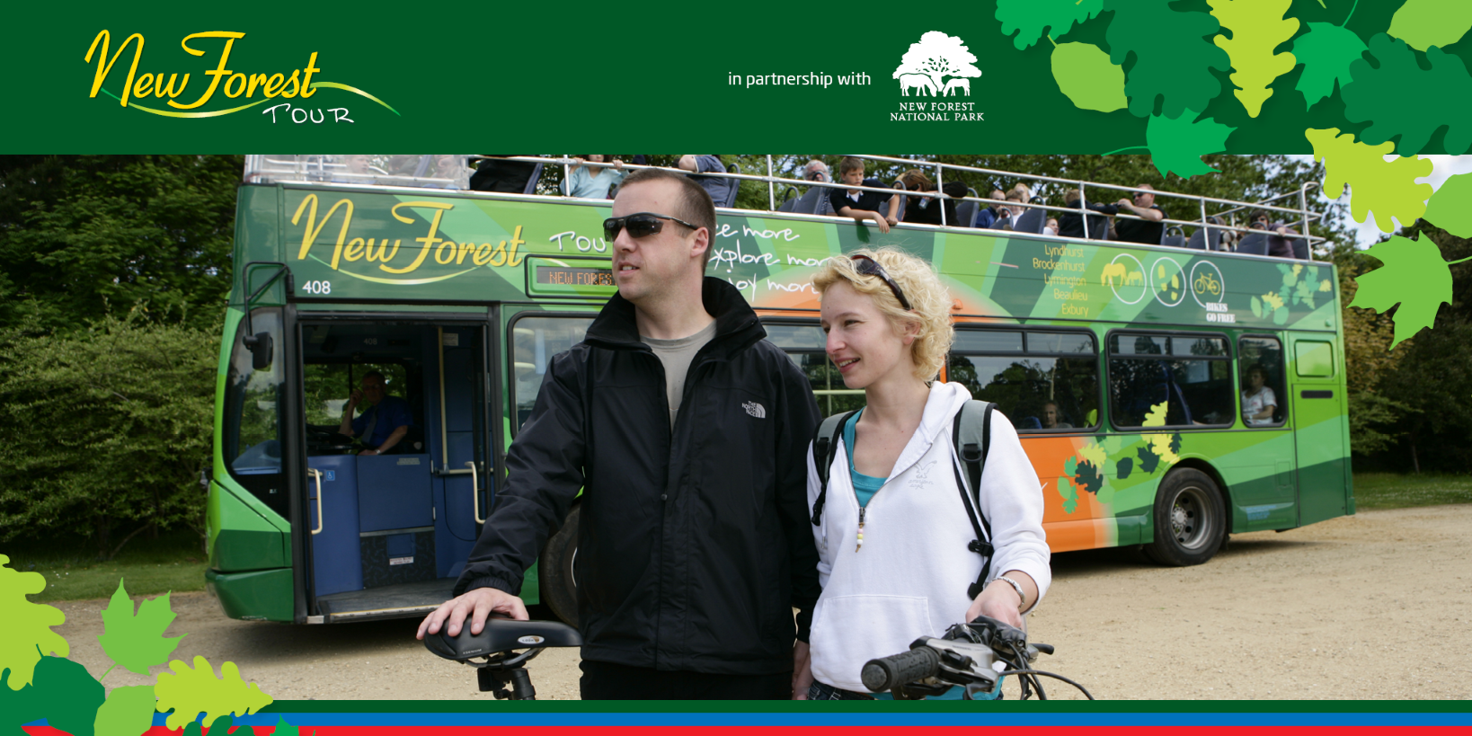 Couple with bike in front of bus