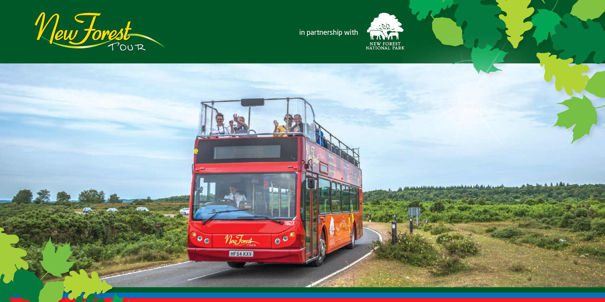 picture of red route bus going through the forest