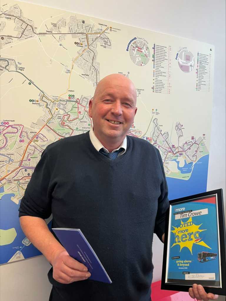 Tim with his certificate and voucher