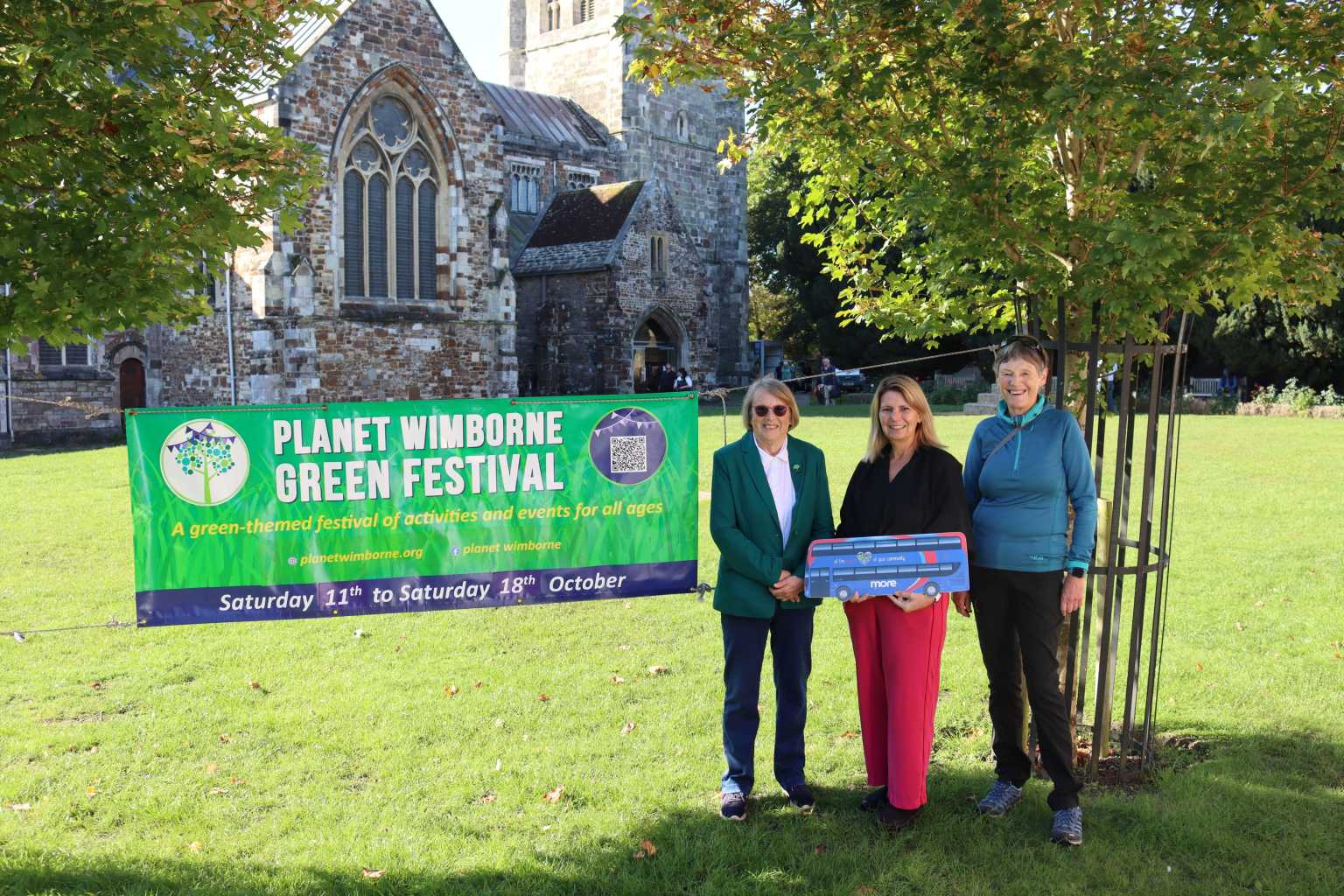 Pic promoting Planet Wimborne Green Festival outside Wimborne Minster