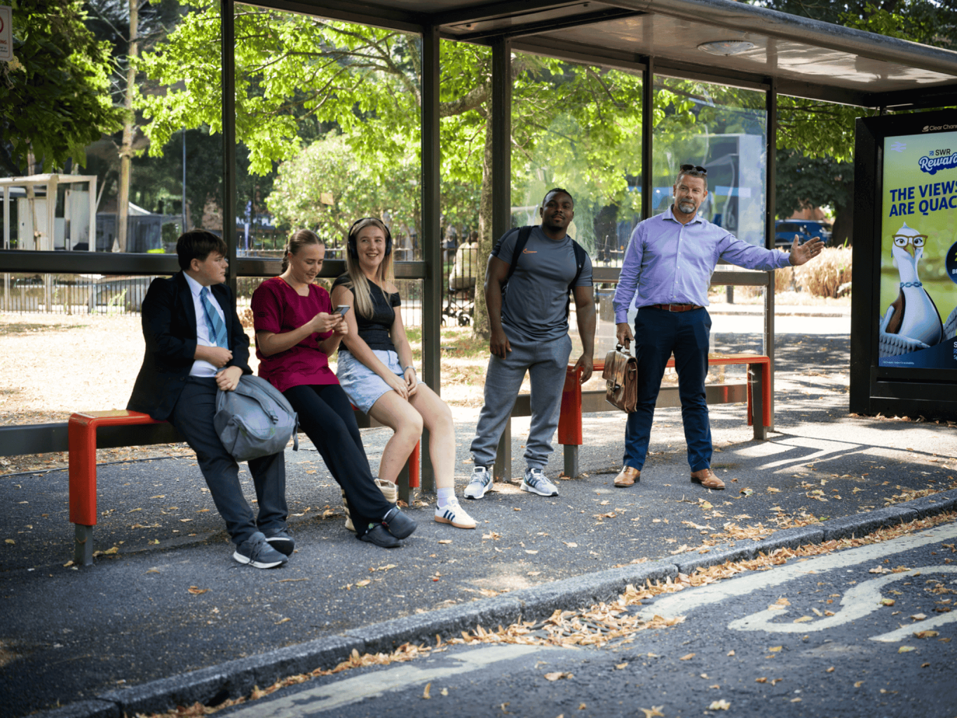people stood at a bus stop