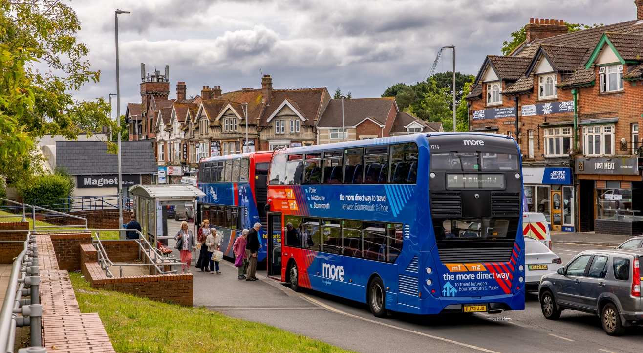 m1m2 bus at a bus stop behind another bus