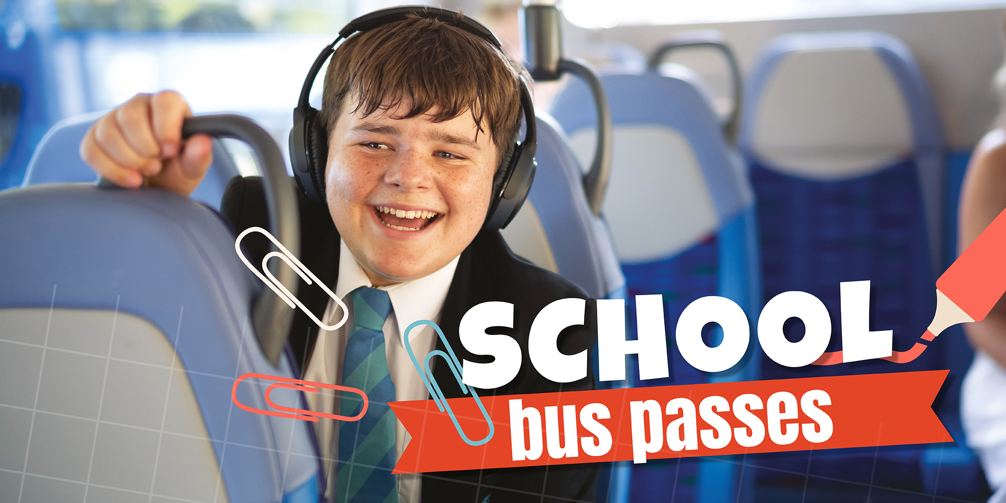 school boy inside a bus wearing headphones