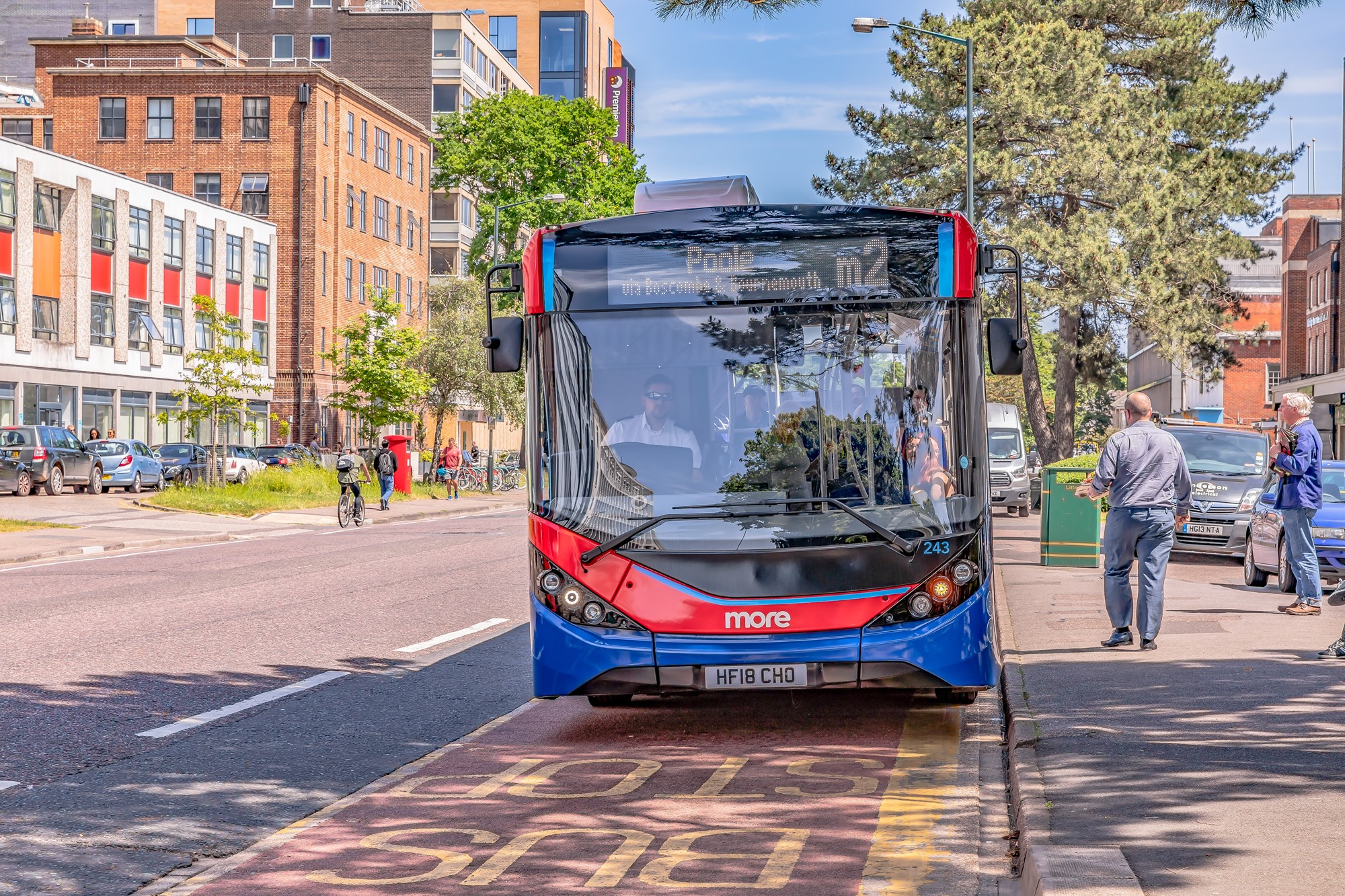 A bus pulled up at a bus stop